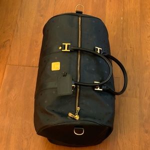 Black and gold MCM duffle bag